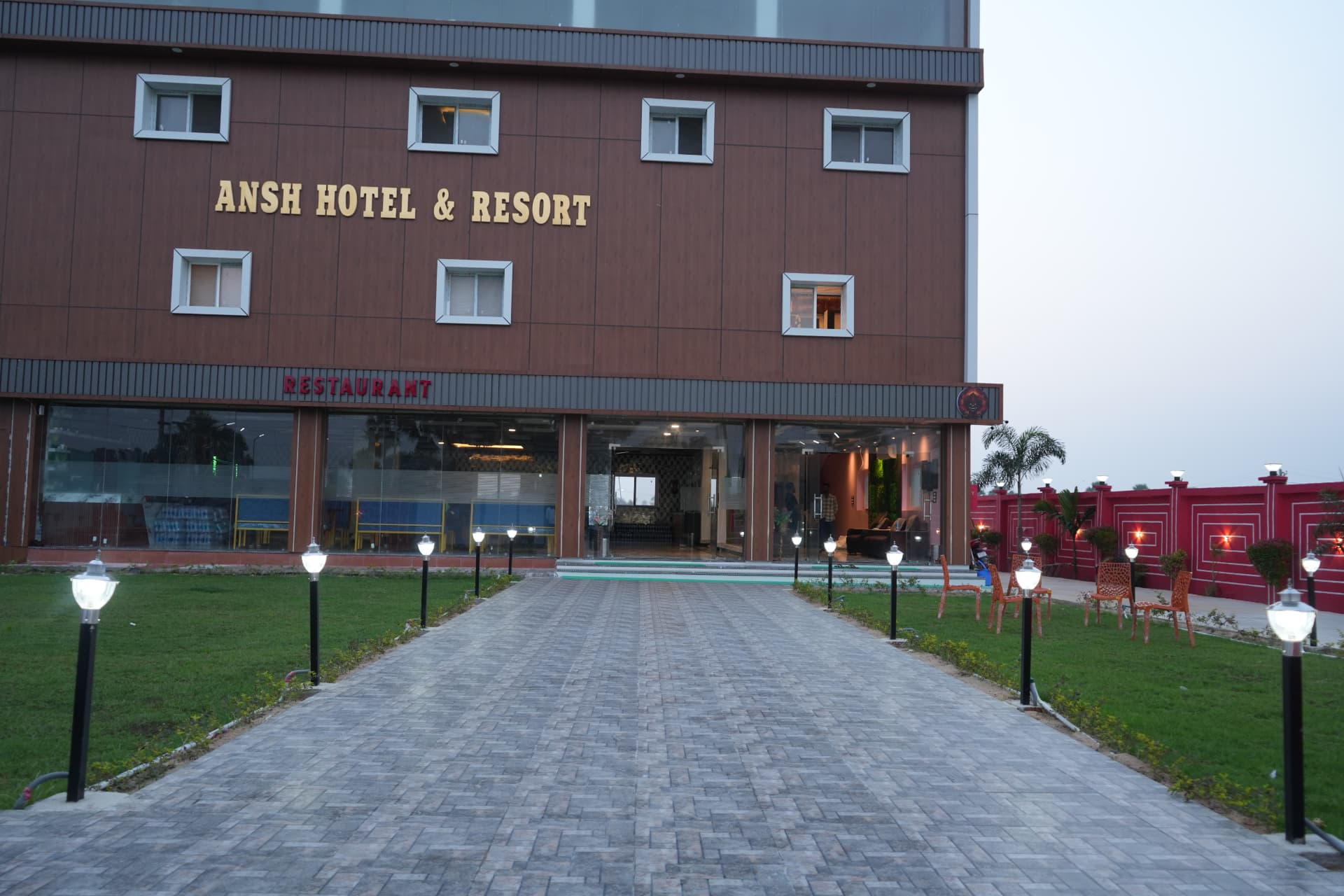 Garden, outdoor seating and entrance walkway at Ansh Hotel & Resort